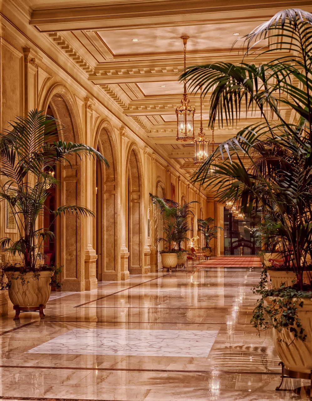 Moody hotel lounge with warm layered lighting
